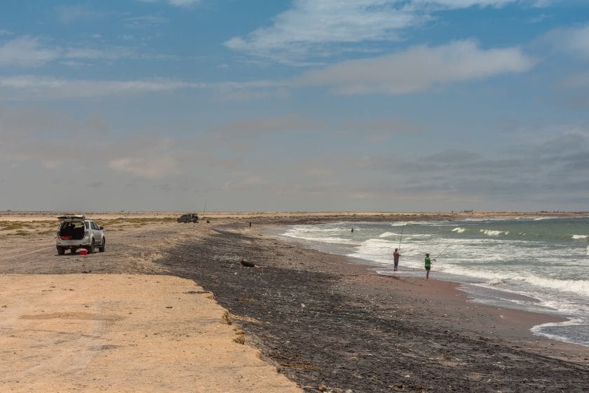 Surf fishing on the Skeleton Coast in the north of Swakopmund, Namibia